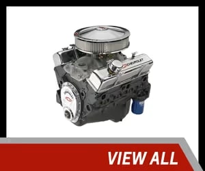 High-performance Chevrolet engine with chrome finish and air filter, designed for improved power and efficiency in custom vehicles.