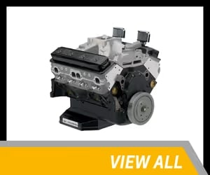 High-performance automotive engine with a black and silver design, featuring dual throttle bodies and a sturdy base, ideal for vehicle upgrades and replacements.