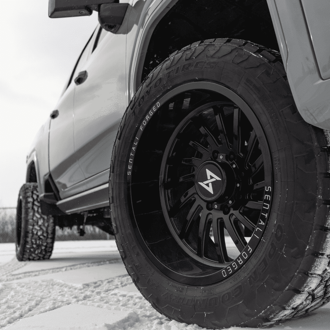 Close-up view of multiple car tires showcasing tread patterns and rubber texture, ideal for automotive and tire-related content.