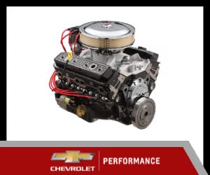 Chevrolet performance engine with chrome intake manifold and red ignition wires, showcasing high-performance automotive engineering for enthusiasts and builders.