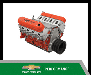 Chevrolet LTX 376 performance engine showcased, featuring a vibrant orange intake manifold and sleek silver engine block, designed for high-performance vehicles.
