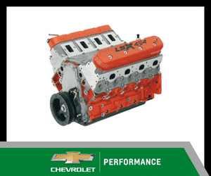 Chevrolet LSX 454 performance engine with orange valve covers and unique design, showcasing advanced engineering ideal for high-performance vehicles.