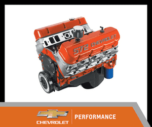 High-performance Chevrolet 572 engine with bright orange finish, featuring detailed components and ample horsepower for automotive enthusiasts.