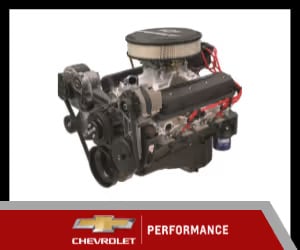 Chevrolet performance engine with detailed components including carburetor and pulleys, showcasing high-performance automotive design.
