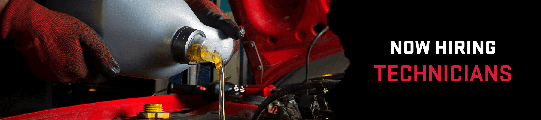 Hands wearing protective gloves pouring oil from a container into a vehicle's engine, promoting job opportunities for technicians in an automotive service setting.