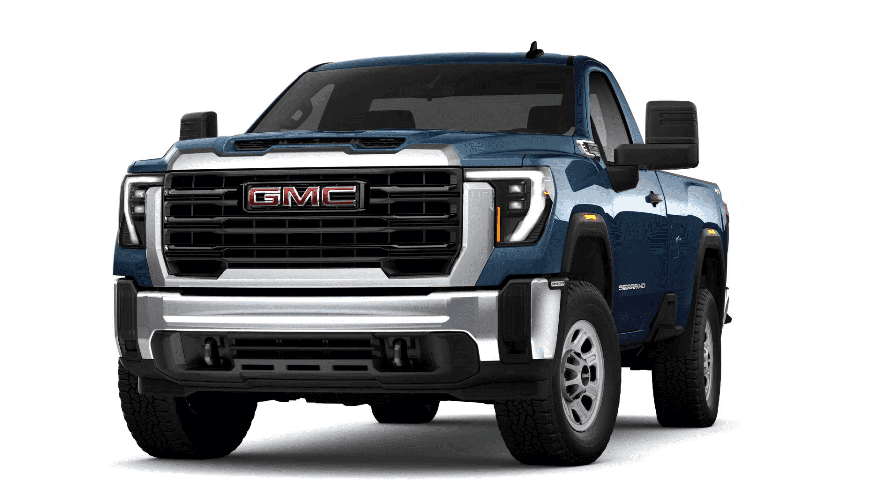 A blue GMC Sierra HD pickup truck showcasing a bold grille, rugged design, and off-road-ready tires, positioned at a slight angle to highlight its robust front profile.
