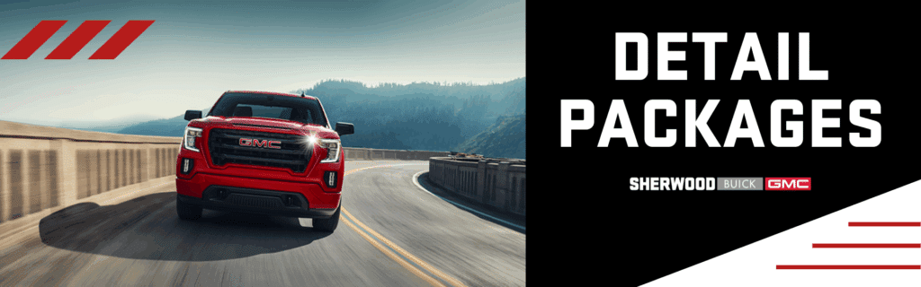 Red GMC truck driving along a scenic highway with mountains in the background, promoting detail packages by Sherwood Buick GMC.